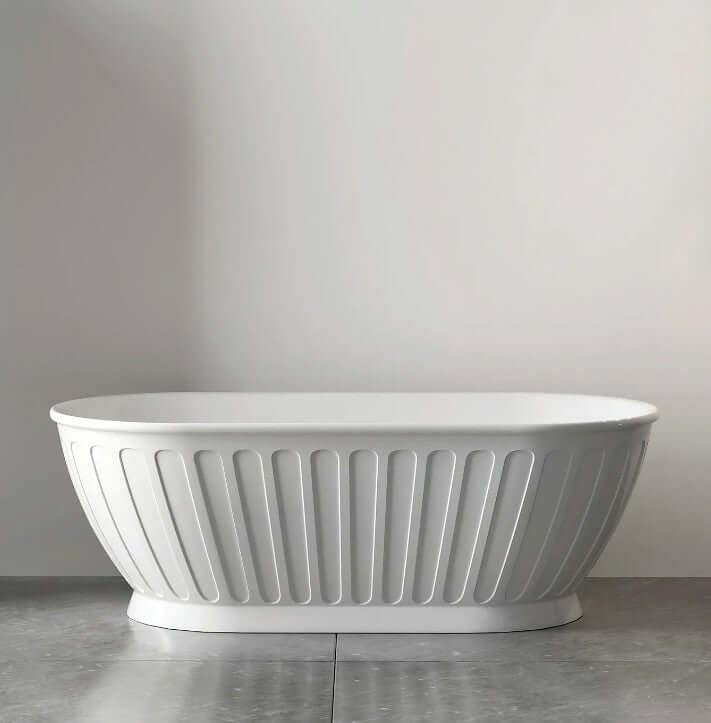 Freestanding oval bathtub in white, featuring a sleek, ribbed design for a modern luxury bathroom upgrade.