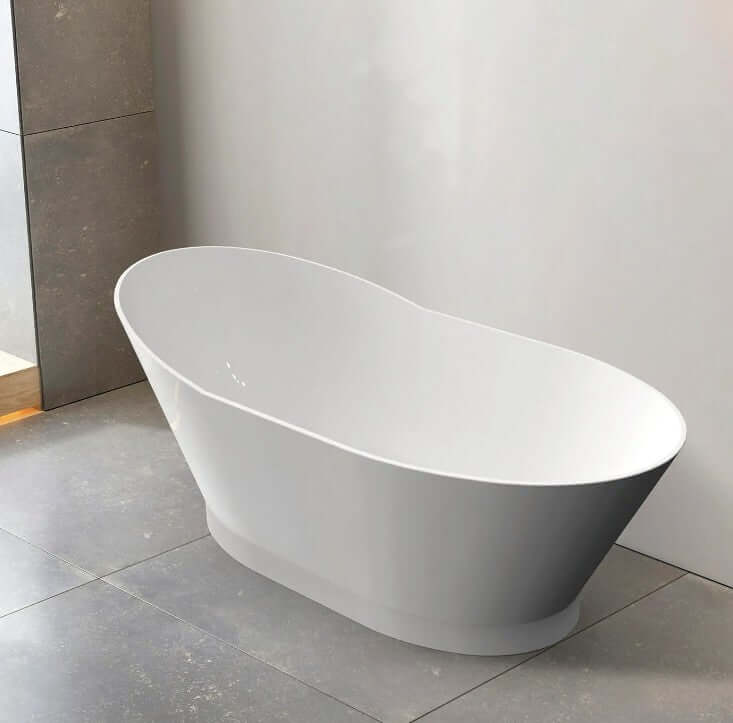 Gloss white freestanding curved acrylic bathtub in modern bathroom setting, ideal for affordable luxury DIY projects.