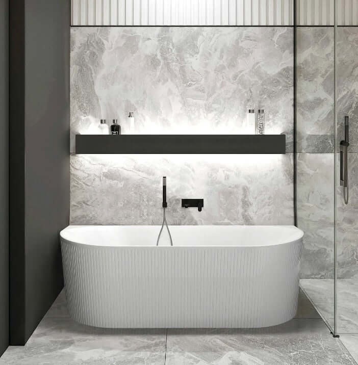 Stylish freestanding oval bathtub in a modern bathroom with marble walls and sleek fixtures. Affordable luxury for DIY projects.