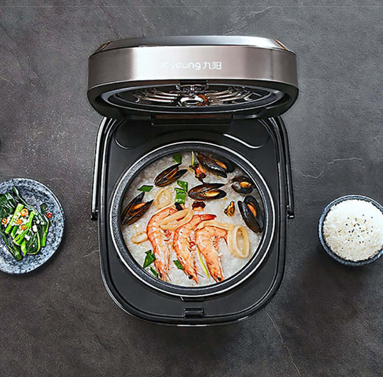 Joyoung Mini Rice Cooker with seafood dish, featuring LED touch panel and removable pot for easy cooking.