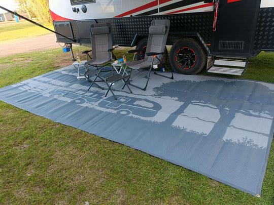 Spacious recycled camping mat under chairs, ideal for outdoor setups and enhancing camping experience.