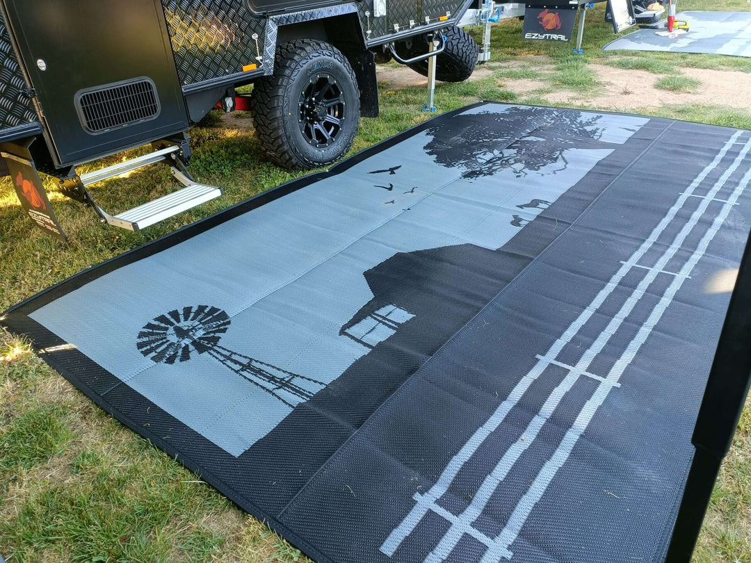 5m x 2.4m recycled poly camping mat with rustic design, perfect for outdoor adventures and RV setups. Affordable and durable.