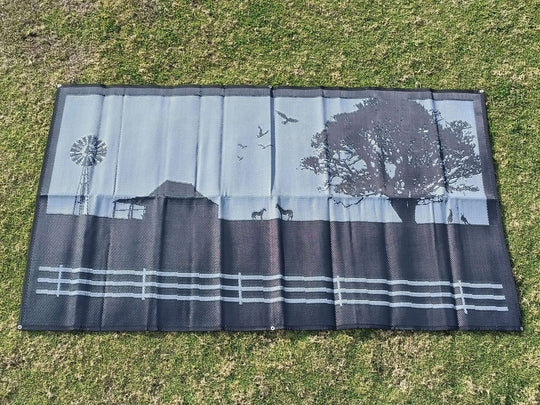 Country Grey recycled poly mat with farm scenery design on grass, perfect for outdoor camping and DIY adventures.