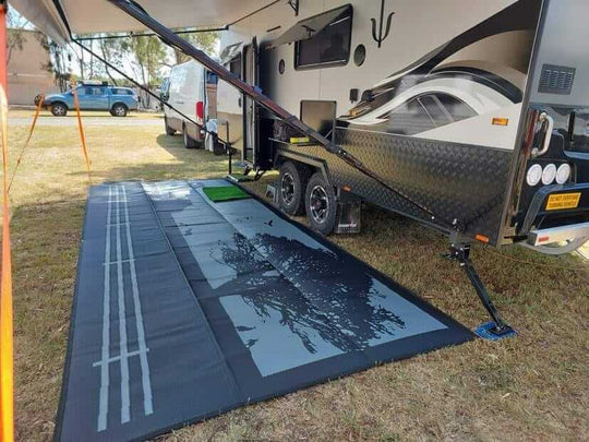 Large Country Grey 6m x 2.4m recycled poly camping mat set up under an awning next to a stylish camper van.