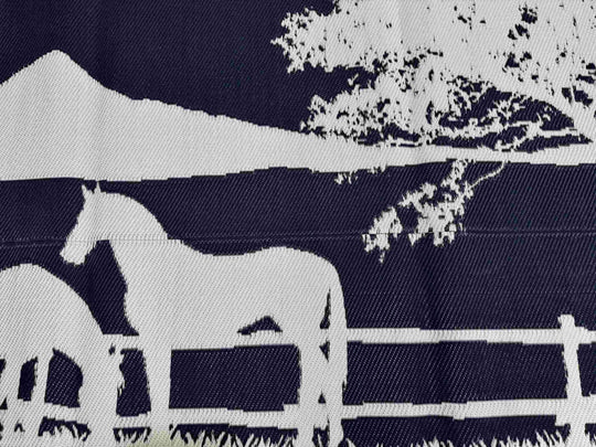 Silhouette of horses in a scenic landscape on a recycled poly camping mat. Ideal for outdoor adventures and camping setups.