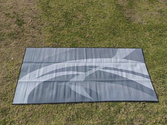 Swish grey 5m x 2.4m recycled poly camping mat on grass, ideal for outdoor adventures and large setups.