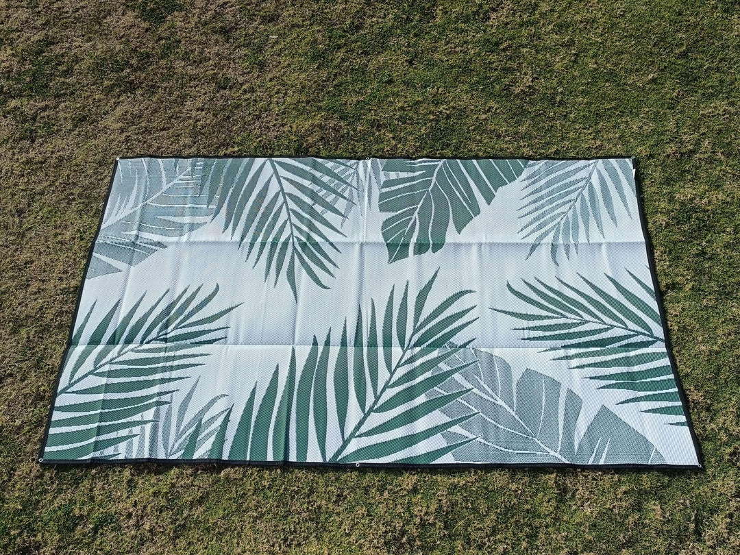 Large recycled poly camping mat with tropical leaf design, perfect for outdoor spaces and durability.