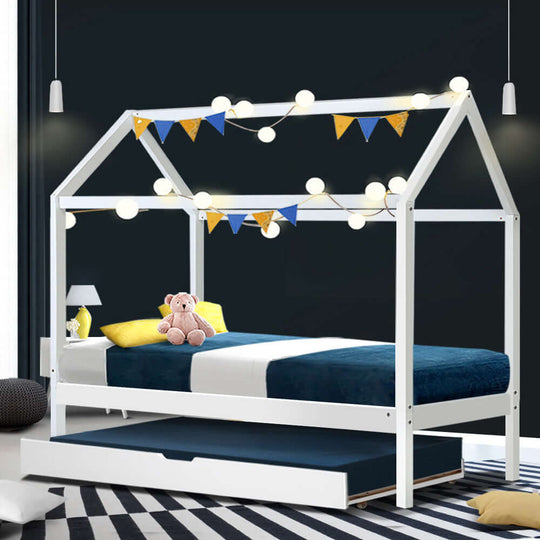 Artiss HOLY wooden trundle daybed frame for kids in white with festive lights and decorative bunting.