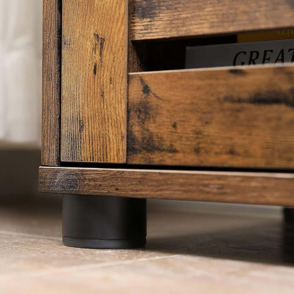 Close-up of VASAGLE rustic brown storage cabinet with sturdy adjustable feet, showcasing durable craftsmanship and DIY-friendly design.