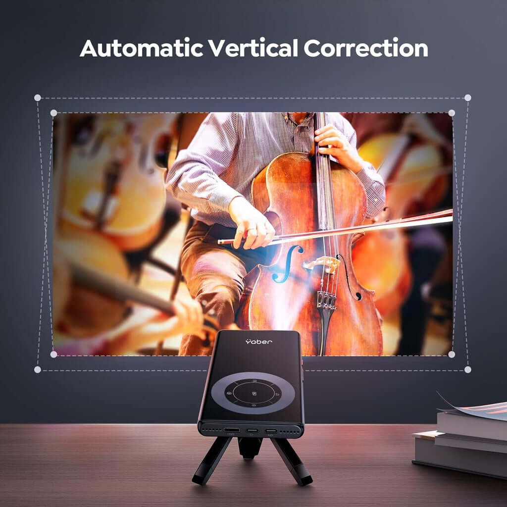 YABER Pico T1 mini projector with automatic vertical correction showcasing a vibrant cello performance on a DIY luxe setup.