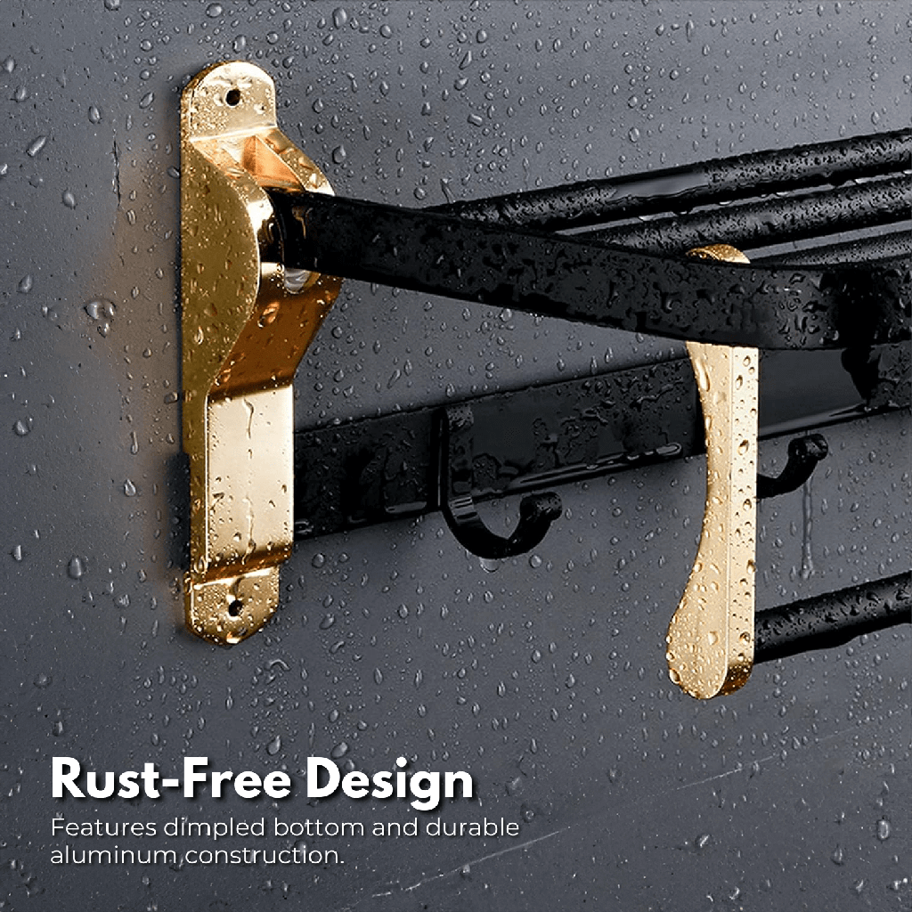 Black and gold wall mount towel holder from Gominimo's space aluminum bathroom set, showcasing rust-free design under water droplets.