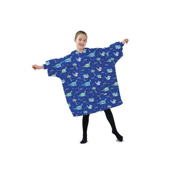 Kid in a dark blue dinosaur hoodie blanket, showcasing its oversized design and fun, colorful print for cozy warmth.