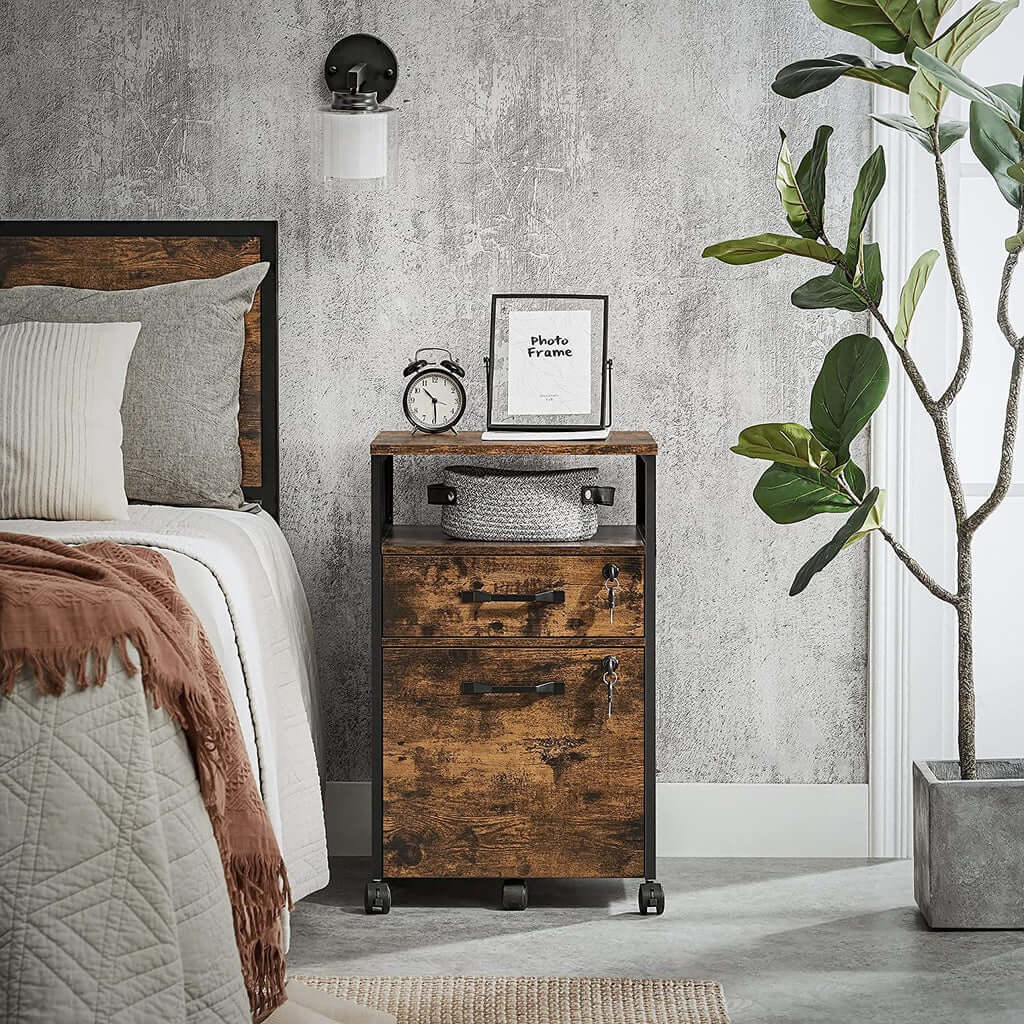 Industrial VASAGLE office file cabinet with lockable drawers in rustic brown and black beside a bed in a cozy room.