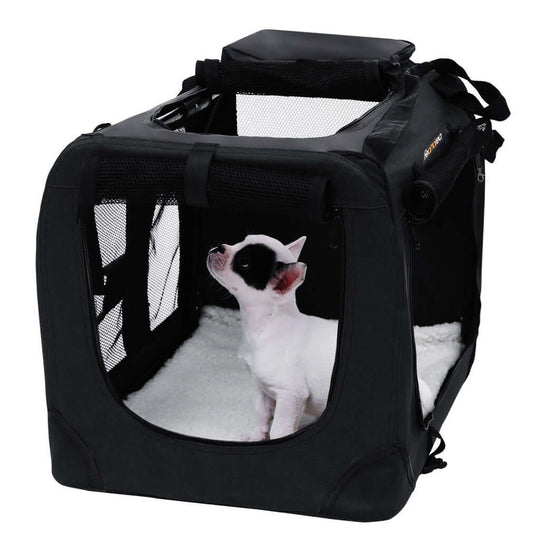 Black FEANDREA folding fabric pet carrier with a small dog inside, suitable for travel and hiking, affordable and quality design.