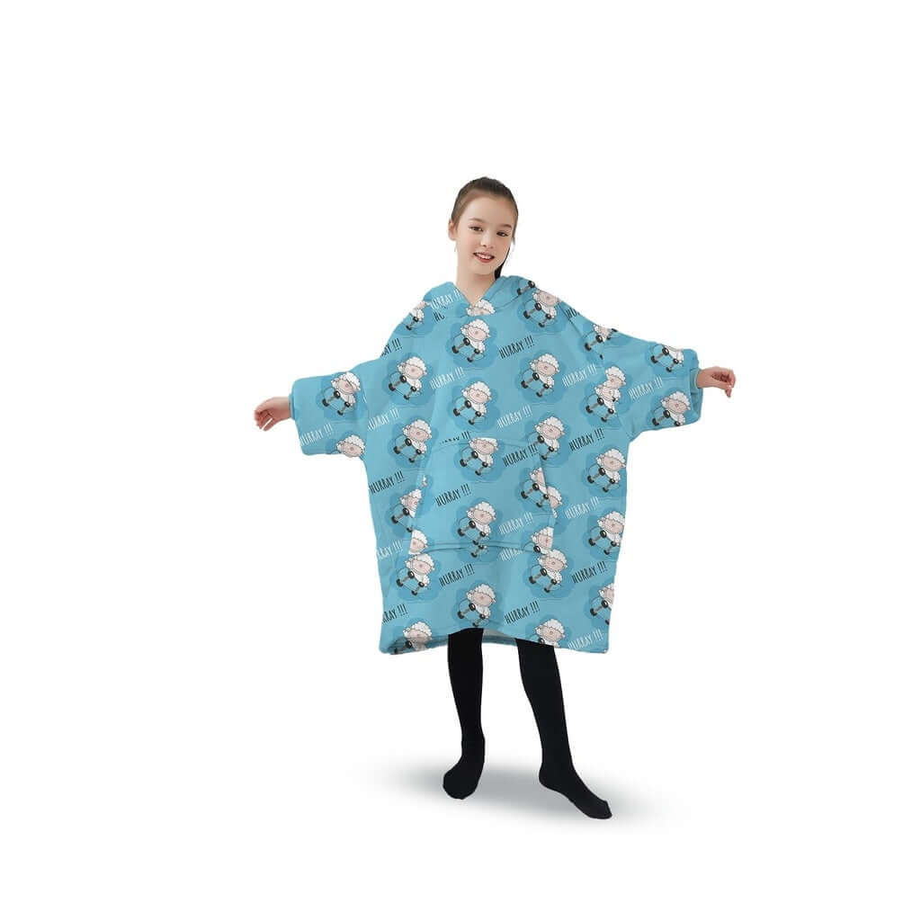 Child wearing a light blue GOMINIMO Hoodie Blanket with sheep design, showcasing comfort and style.