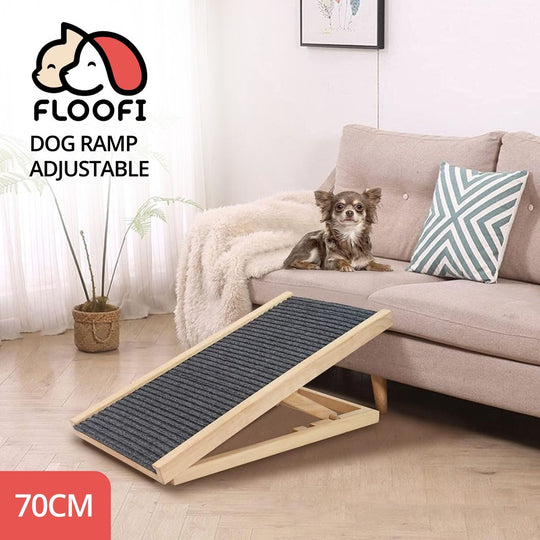 Adjustable dog ramp by Floofi for easy sofa access, 70cm, with a small dog on a cozy couch with home decor in the background.