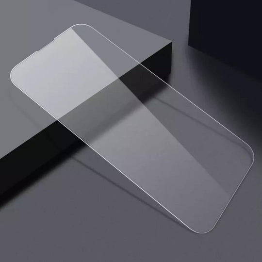 Tempered glass screen protector for smartphones on a dark surface.