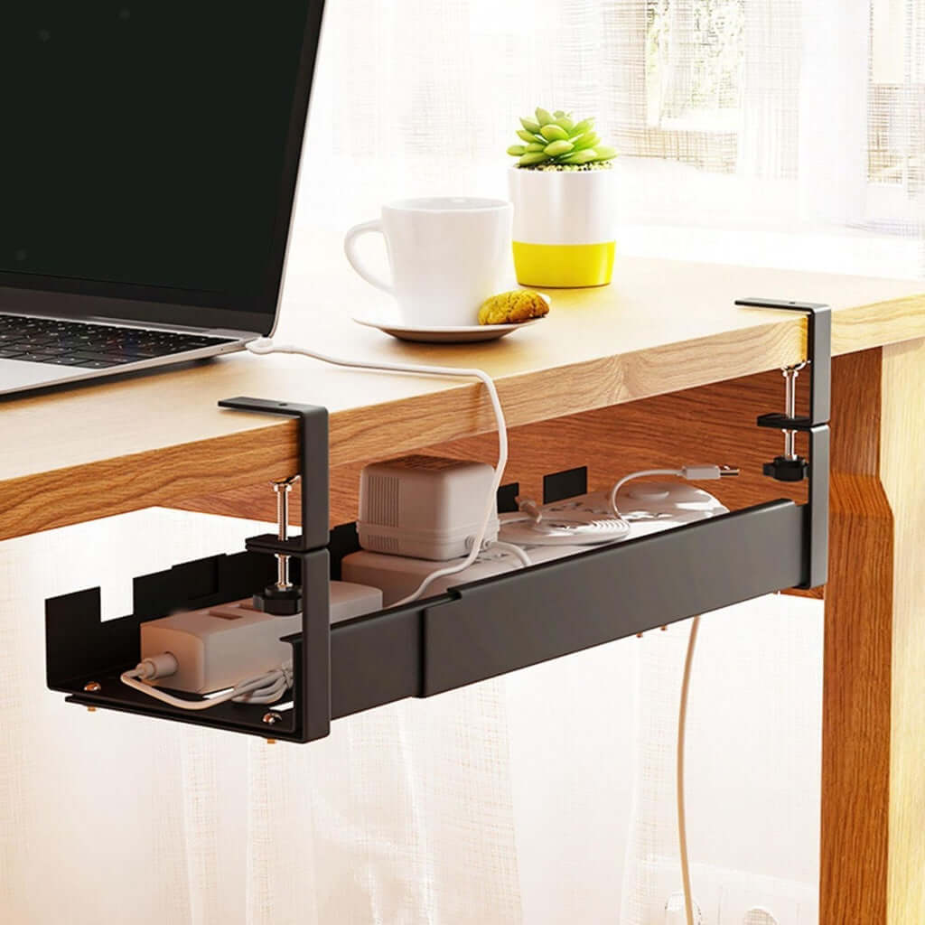 Black GOMINIMO retractable cable management tray clamped under a desk, organizing cables, promoting a neat workspace with no drilling.