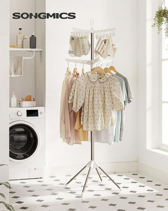 SONGMICS 2-Tier Clothes Drying Rack featuring rotatable arms, hung clothes, and space-saving design in a stylish laundry setting.