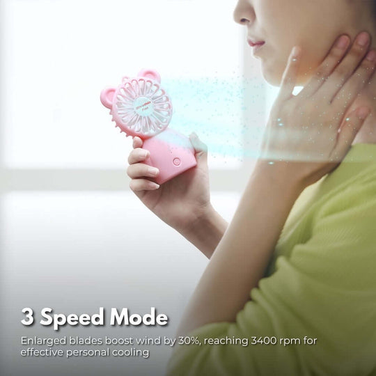 Gominimo Pink handheld fan in use, showcasing 3 speed settings for effective personal cooling on-the-go.