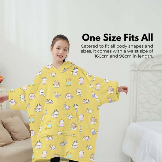 Kid wearing GOMINIMO yellow hoodie blanket with cat design, showcasing one size fits all for comfort and style.