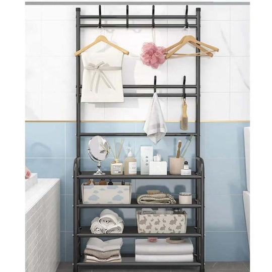 Black GOMINIMO clothes rack with 8 hooks and 4-tier shelving in bathroom for organizing clothes, shoes, and accessories. Affordable DIY luxe.