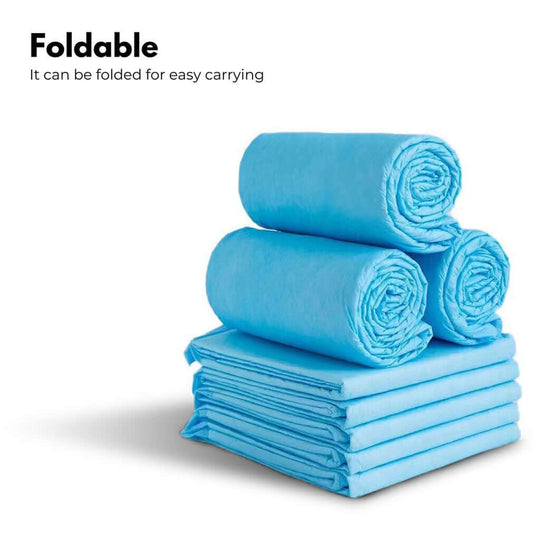 Foldable blue pet training pads stacked for easy carrying, perfect for on-the-go pet training solutions.