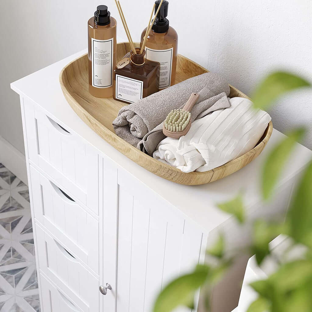 White VASAGLE floor cabinet with 4 drawers and decorative items on top, showcasing affordable and quality storage for any room.