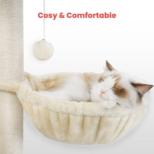 Cat sleeping comfortably in a soft furry hammock attached to a scratching post with a hanging toy ball, highlighting cozy and comfortable pet furniture.