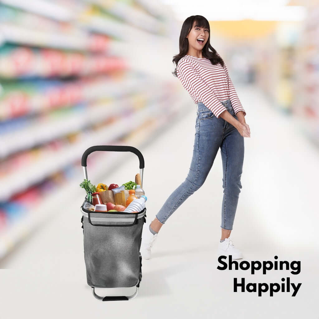 Woman happily shopping with a GOMINIMO foldable aluminum trolley cart in a supermarket aisle.