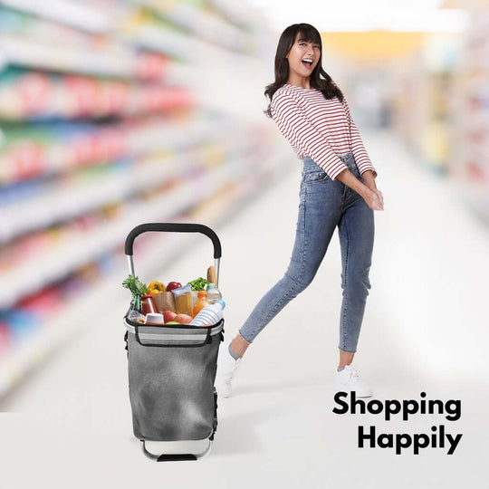 Woman happily shopping with a GOMINIMO foldable aluminum trolley cart in a supermarket aisle.